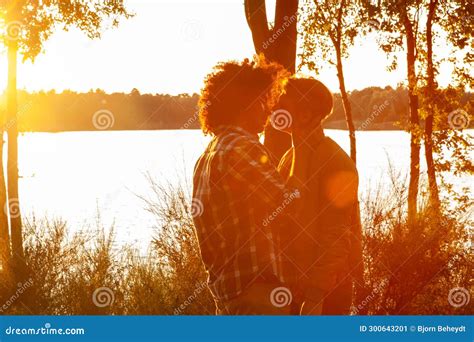 “The Kiss” –  A Romantic Embrace Bathed in Golden Light!